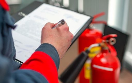 Engineer Professional are Checking A Fire Extinguisher Using Clipboard or checking Industrial fire control system,Fire Alarm controller, Fire notifier, Anti fire.System ready In the event of a fire.